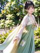 A woman in a green and white dress standing in a garden.